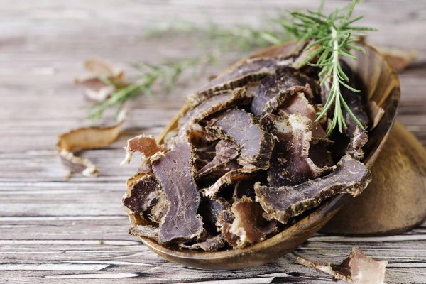 Deer Jerky in wooden bowls on a rustic table